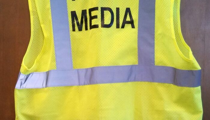fluorescent-vests-provided-to-media-workers